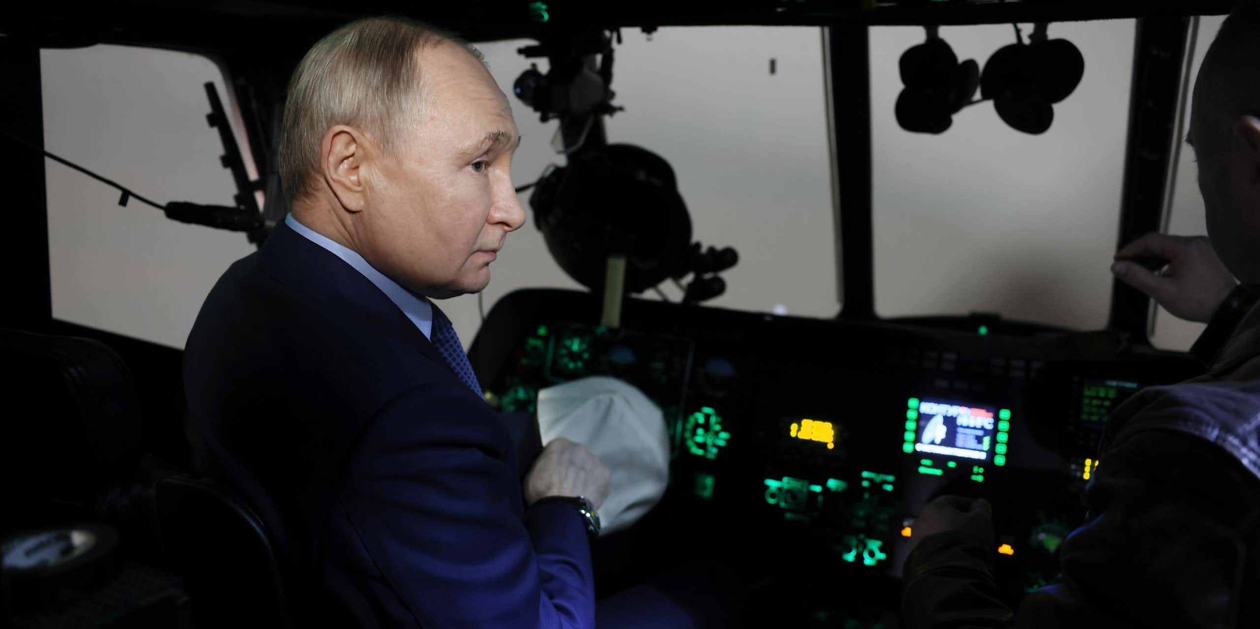 Russian president Vladimir Putin sits in the cockpit of a Russian warplane, March 2024
